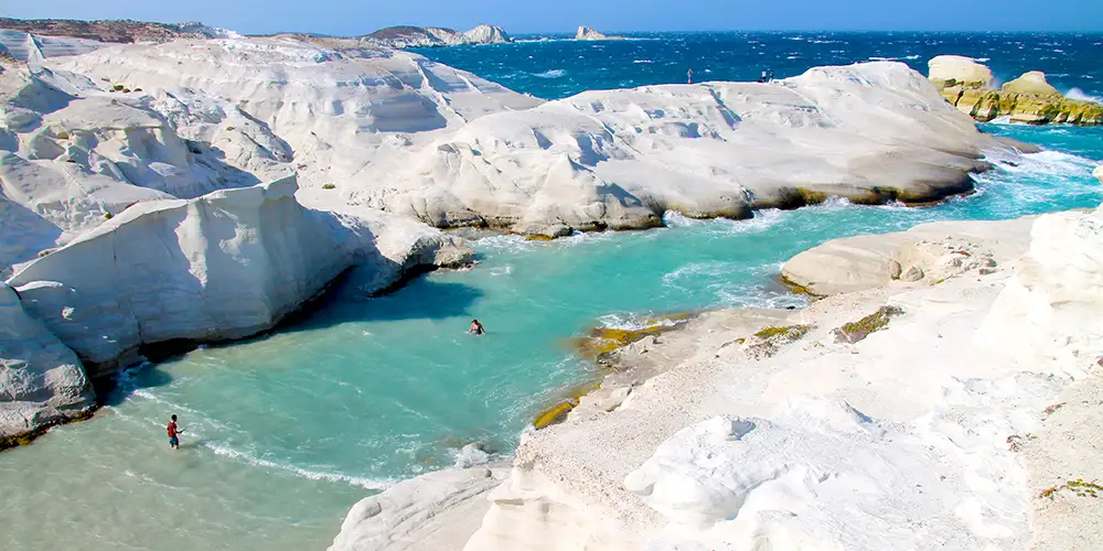 Sol, strand og scooter